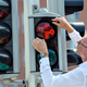 Director of Moesgaard Museum Mads Koehler Holst replaces the first of many pedestrian signals on Aug. 26.